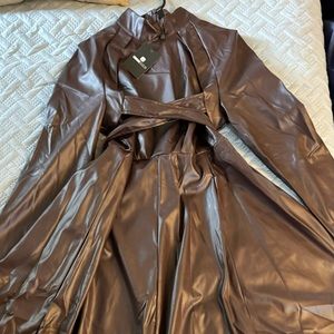 Faux leather dress with crisscross front detail.